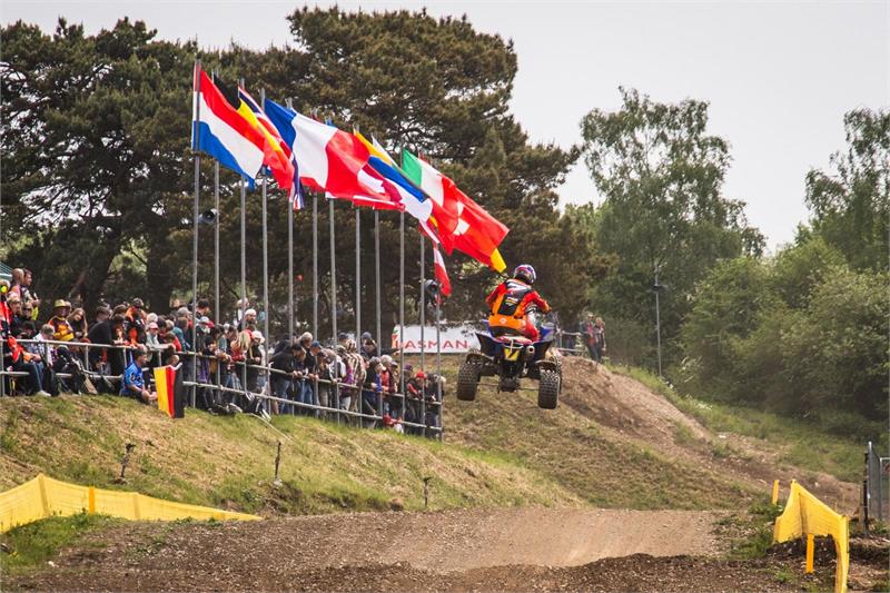 Harry Walker EMX in front of flags